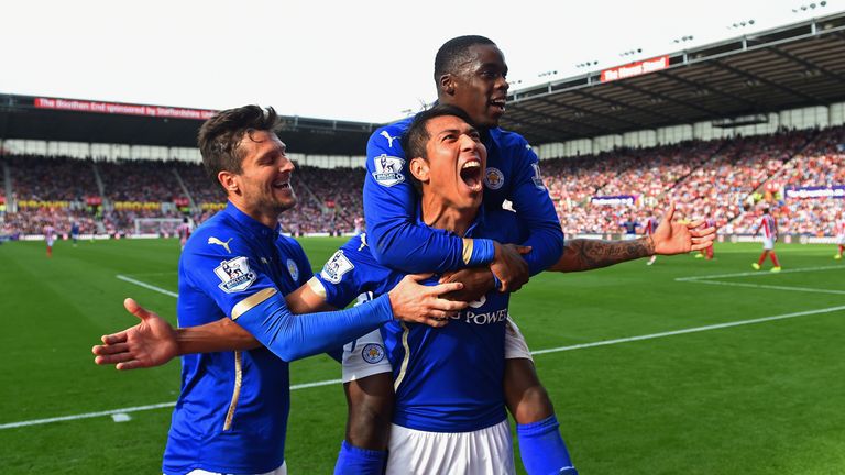 STOKE ON TRENT, ENGLAND - SEPTEMBER 13:  Leonardo Ulloa of Leicester City celebrates scoring the first goal with David Nugent and Jeffrey Schlupp of Leices