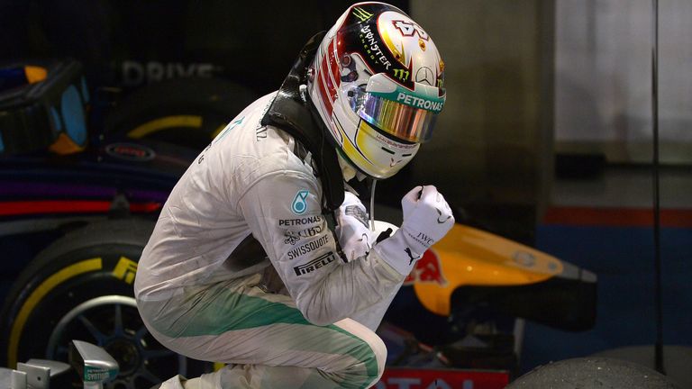 Lewis Hamilton of Britain celebrates after winning the Singapore Grand Prix 