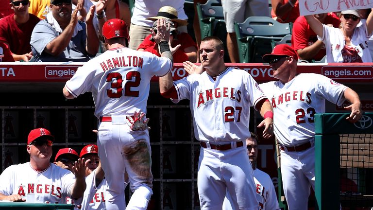  Josh Hamilton #32 of the Los Angeles Angels is greeted by Mike Trout #27 after scoring a run in the second inning against Oakland Athletics