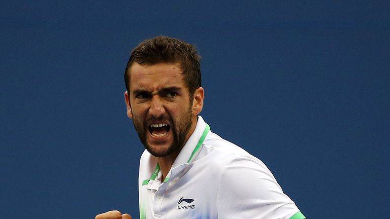 Marin Cilic of Croatia reacts in the third set against Roger Federer of Switzerland during their men's singles semifinal matc