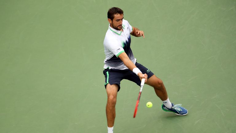 Marin Cilic returns a shot in the US Open final