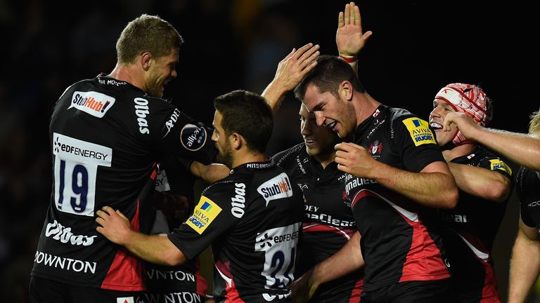 Mark Atkinson of Gloucester is congratulated after scoring against London Welsh