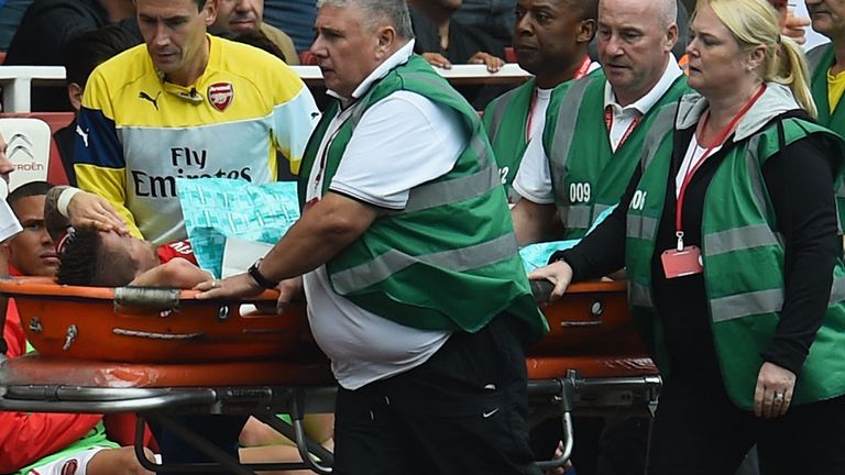 Mathieu Debuchy is stretchered during Arsenal's Premier League clash with Manchester City on September 13