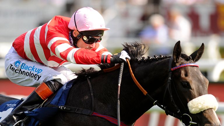 DONCASTER, ENGLAND - SEPTEMBER 10:  Paul Mulrennan riding Mecca's Angel win The John Smith's Original Scarbrough Stakes at Doncaster racecourse.
