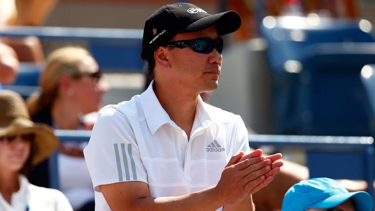 Michael Chang reacts as Kei Nishikori plays against Novak Djokovic at the US Open 2014