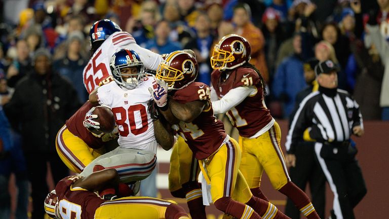 Victor Cruz of the New York Giants is stopped short of the endzone by Washington Redskins