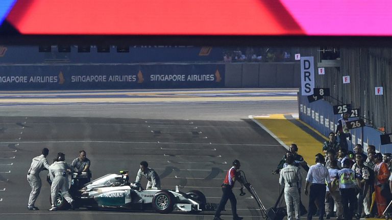 Nico Rosberg is pushed off the grid