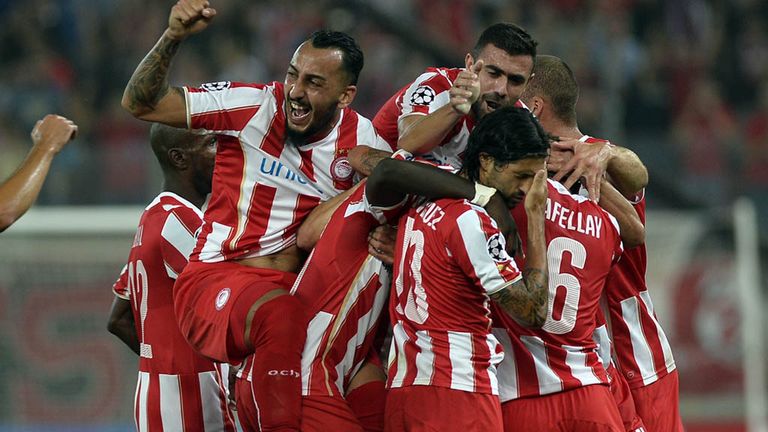 Olympiakos players celebrate after scoring