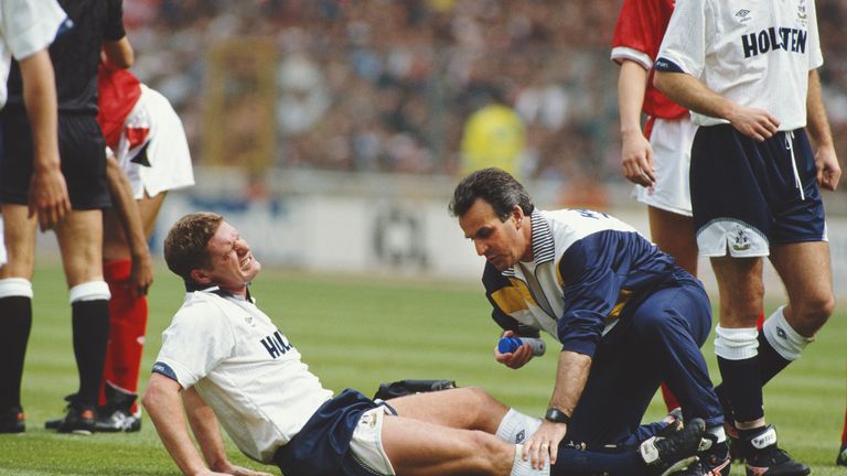 Tottenham Hotspur player Paul Gascoigne receives treatment before being stretchered off during the 1991 FA Cup Final against Nottingham Forest at Wembley