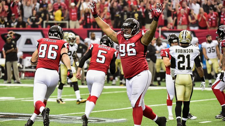 Paul Soliai (96) celebrates as the Falcons beat the Saints in overtime