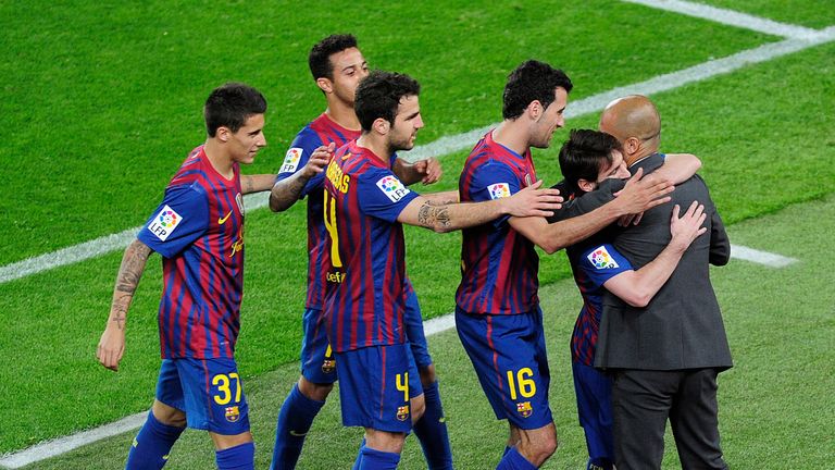 Barcelona's players celebrates with coach Pep Guardiola