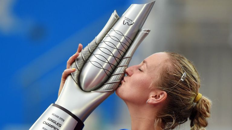 Petra Kvitova kisses the trophy after her win over Eugenie Bouchard  in the final of the 2014 Wuhan Open