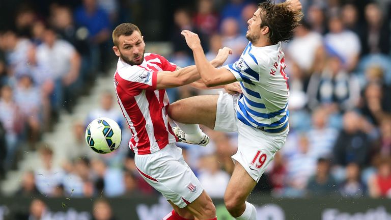 Phil Bardsley challenges Niko Kranjcar during the match between QPR and Stoke City at Loftus Road