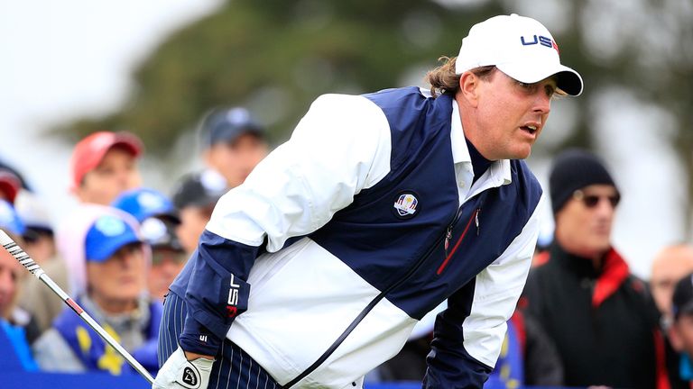 Phil Mickelson watches his tee shot on the 10th hole 