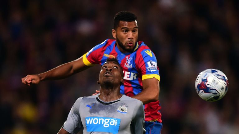 Crystal Palaces' Adrian Mariappa and Newcastle United's Sammy Ameobi during the Capital One Cup Third Round match at Selhurst Park, London.