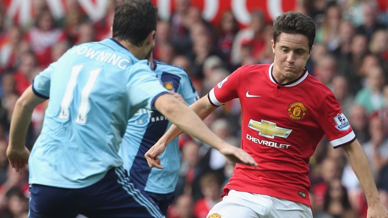 MANCHESTER, ENGLAND - SEPTEMBER 27:  Ander Herrera of Manchester United in action with Stewart Downing of 