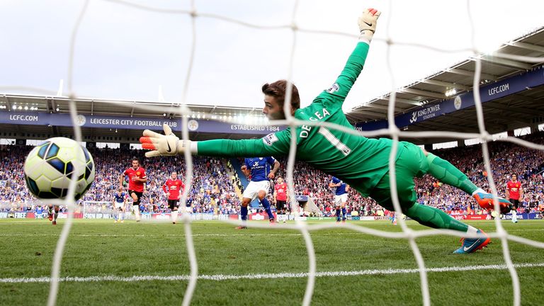 LEICESTER, ENGLAND - SEPTEMBER 21:  David De Gea of Manchester United dives in vain as Leonardo Ulloa (obscured) of Leicester City scores his team's fifth 