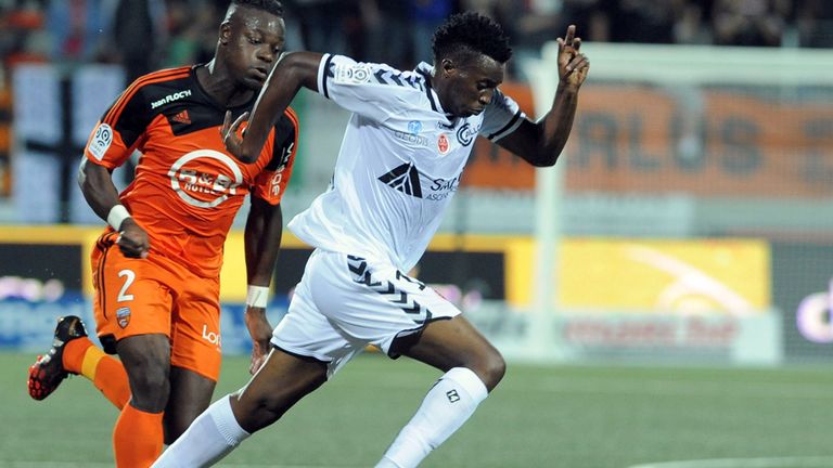 Lorient's French Ivorian defender Lamine Kone (L) vies with Reims' Cameroonian forward Benjamin Moukandjo Bile