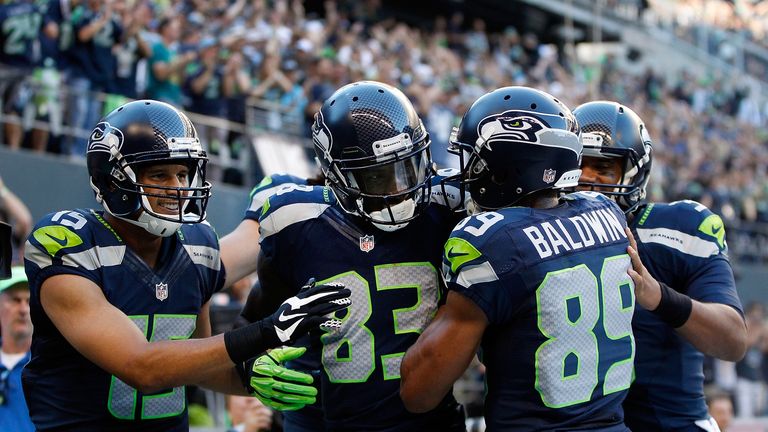 Wide Receiver Ricardo Lockette of the Seattle Seahawks celebrates with teammates after scoring a touchdown