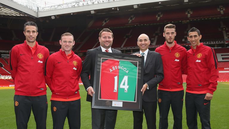 Robin van Persie, Wayne Rooney, Group Managing Director Richard Arnold, David de Gea and Angel di Maria of Manchester United present CEO of Abengoa