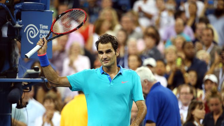 Roger Federer reacts after defeating Marcel Granollers during their men's singles third round match at the US Open