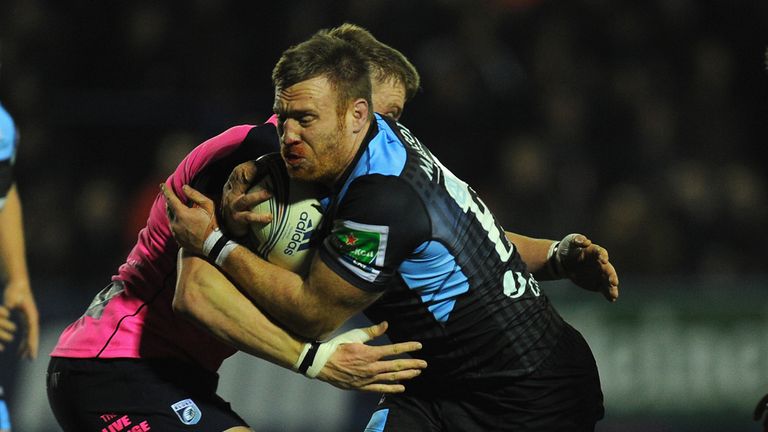CARDIFF, WALES - DECEMBER 06:  Glasgow player Tyrone Holmes (c) breaks through the Cardiff defence during the Heineken Cup Pool 2 round 3 match between Car