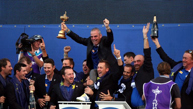 Before being lifted up by his triumphant players