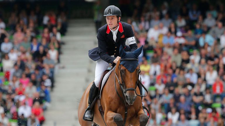 Britain's Scott Brash rides Hello Sanctos during the team and individual qualifying show jumping event at the FEI World Equestrian Games in Caen