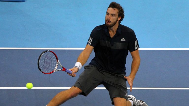 Ernests Gulbis returns a shot in his victory over Philipp Petzschner