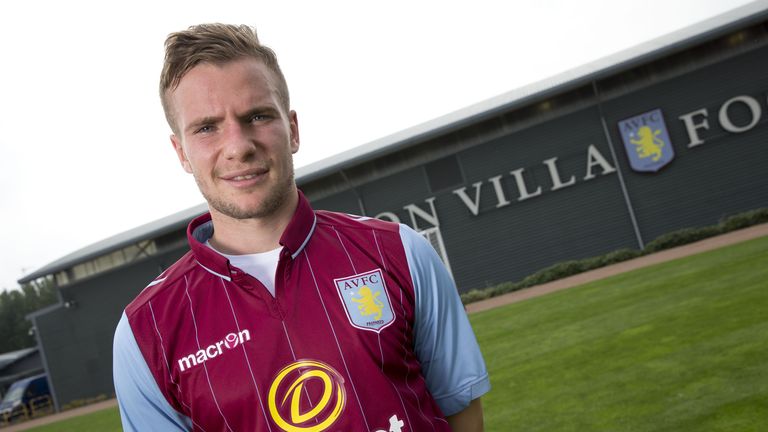 New signing Tom Cleverley of Aston Villa poses at the club's training ground at Bodymoor Heath in Birmingham