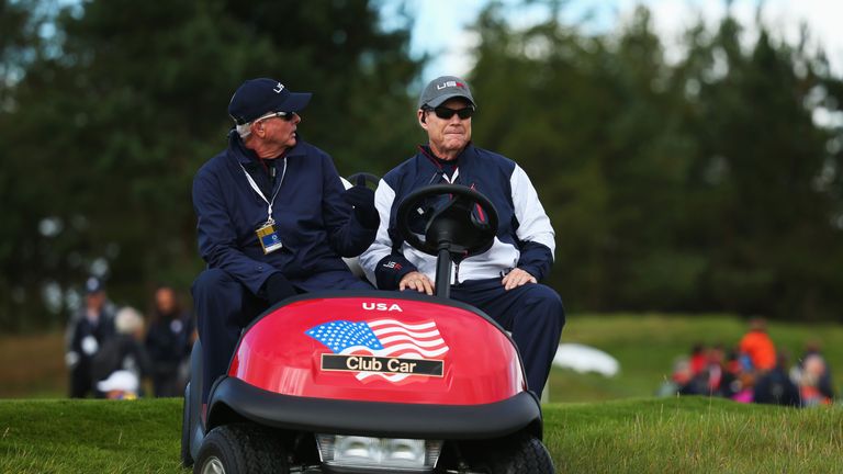 United States team captain Tom Watson (R) talks to Ted Bishop, PGA of America President during practice ahead of the Ryder Cup