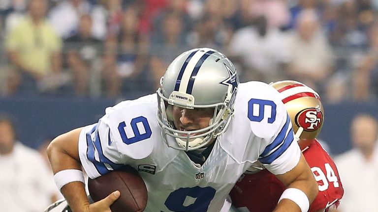 Tony Romo of the Dallas Cowboys is sacked by Justin Smith of the San Francisco 49ers