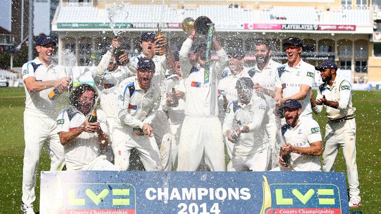 NOTTINGHAM, ENGLAND - SEPTEMBER 12:  Yorkshire celebrate with the County Championship Trophy after beating Notts to secure the league during the fourth day