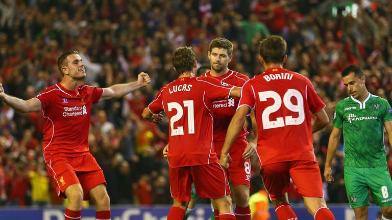 Steven Gerrard of Liverpool celebrates scoring the second goal from the penalty spot with team mates during the UEFA Ch