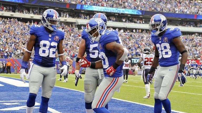 Victor Cruz of the New York Giants celebrates his touchdown with a dance against the Houston Texans 