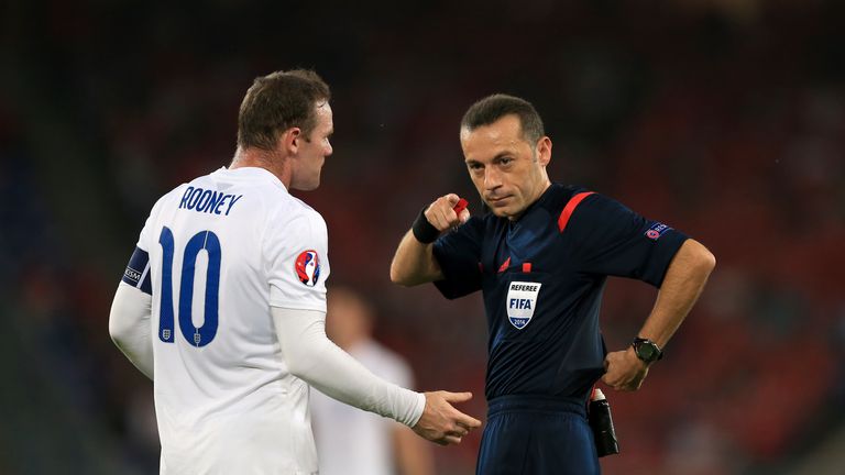 England's Wayne Rooney talks to referee Cuneyt Cakir during a UEFA Euro 2016 qualifying, Group E match at the St Jakob-Park Stadium, Basel, Switzerland