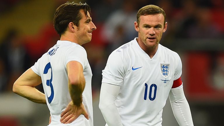LONDON, ENGLAND - SEPTEMBER 03:  Wayne Rooney of England (R) talks with Leighton Baines of England during the International friendly match between England 