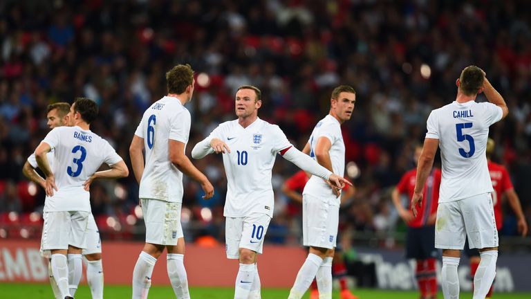 Captain Wayne Rooney of England gives instructions to Phil Jones of England during the International friendly match v Norway at Wembley