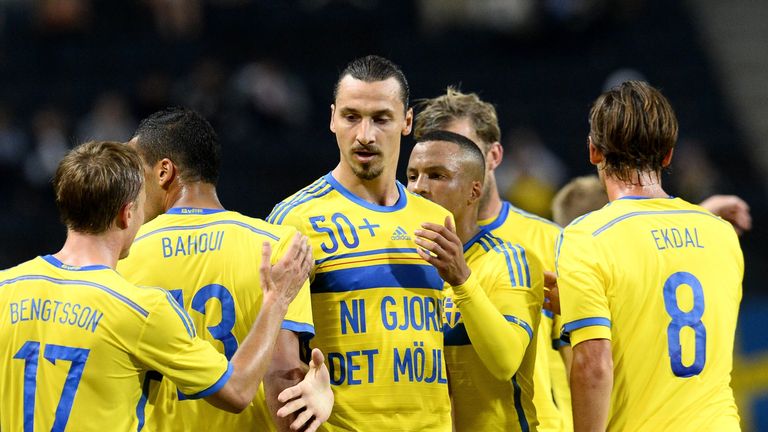 Sweden forward and captain Zlatan Ibrahimovic (C) celebrates with teammates after scoring second goal v Estonia and his 50th goal for his country