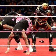Goldust receives a dual Superkick from Jimmy and Jey Uso