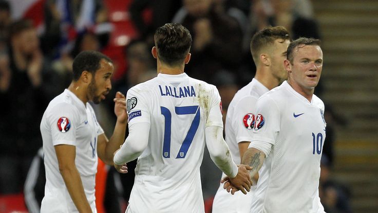 Wayne Rooney (R) is congratulated after scoring his team's fifth goal during a Euro 2016 Qualifier football match between England and San Marino