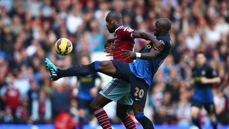 Carlton Cole of West Ham United is challenged by Eliaquim Mangala of Manchester City during the Barclays Premier League match