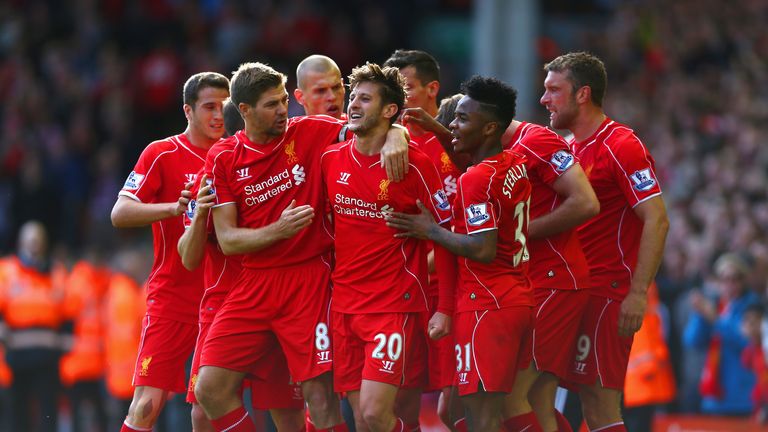 Adam Lallana is congratulated by teammates after scoring his first Liverpool goal to make it 1-0