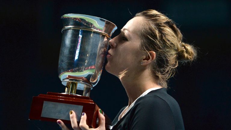 Anastasia Pavlyuchenkova of Russia kisses the trophy after beating Romania's Irina-Camelia Begu in the final of the WTA Kremlin Cup