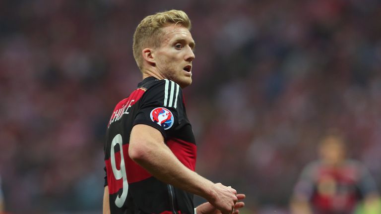 Andre Schurrle of Germany battles for the ball with of Poland during of the EURO 2016 Group D qualifying match, Warsaw
