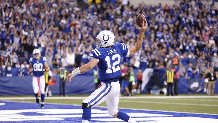 Andrew Luck of the Indianapolis Colts celebrates after rushing for a 13-yard touchdown against the Baltimore Ravens