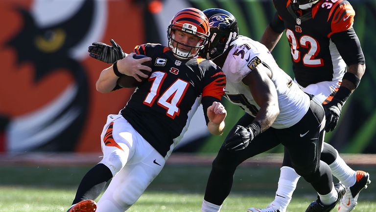  C.J. Mosley #57 of the Baltimore Ravens reaches out to tackle Andy Dalton #14 of the Cincinnati Bengals 