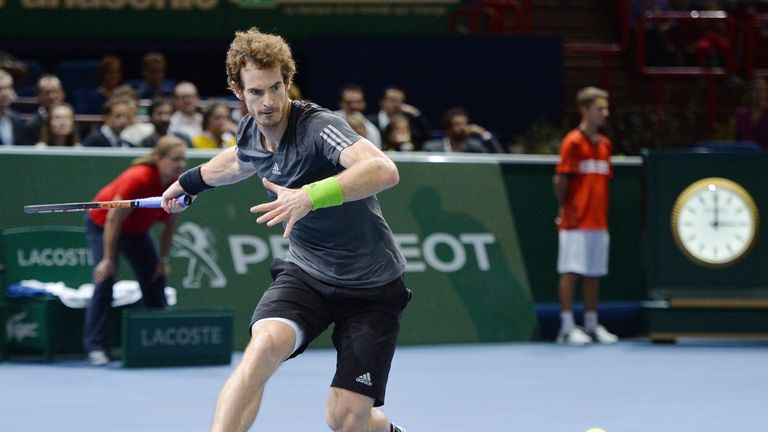 Andy Murray returns the ball at the Paris Masters