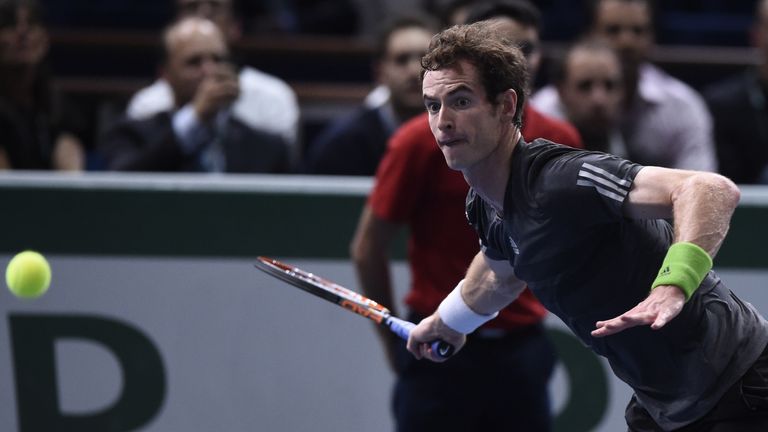 Andy Murray returns the ball at the Paris Masters