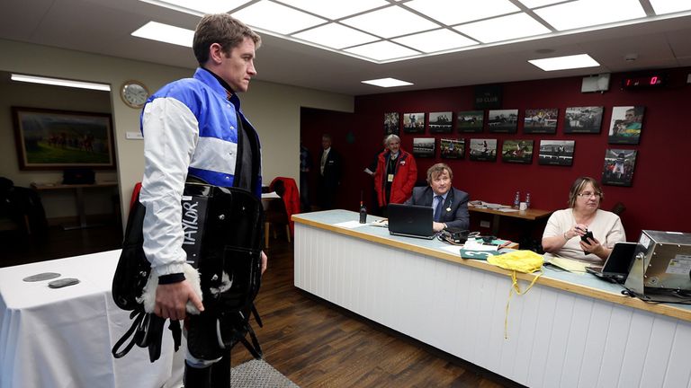 Jockey Barry Geraghty weighs out in the new weighing room at Cheltenham Racecourse.